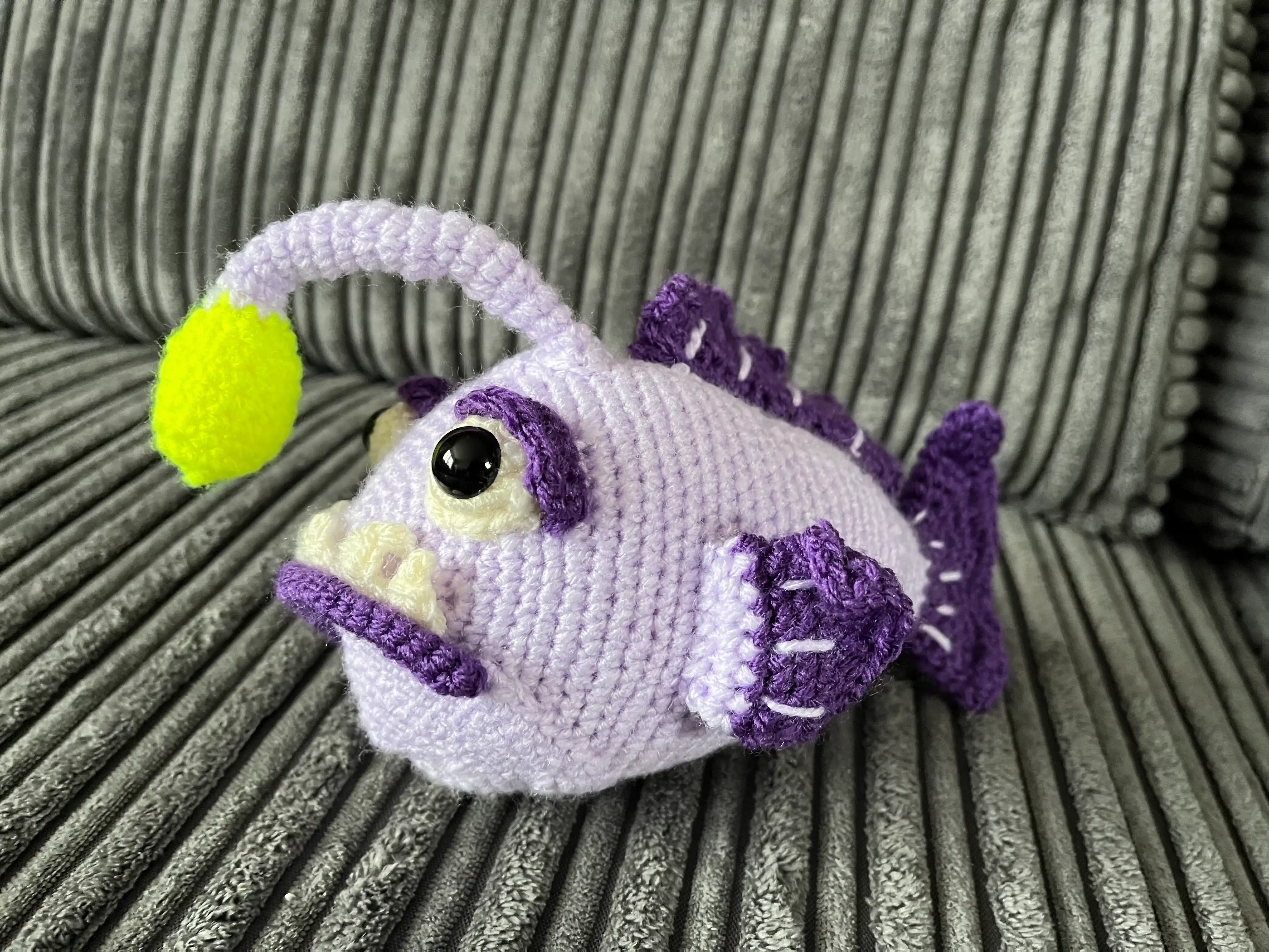 Knitted purple angler fish plushie