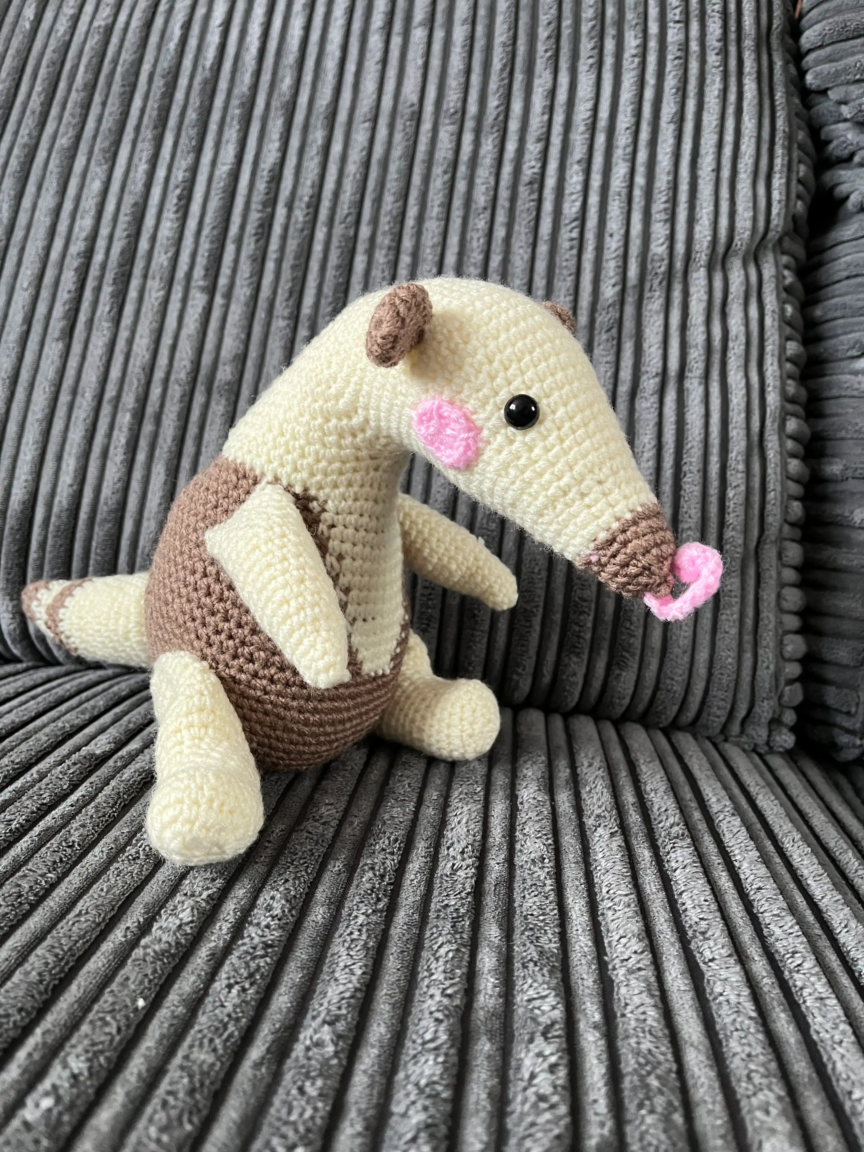 Knitted anteater soft toy