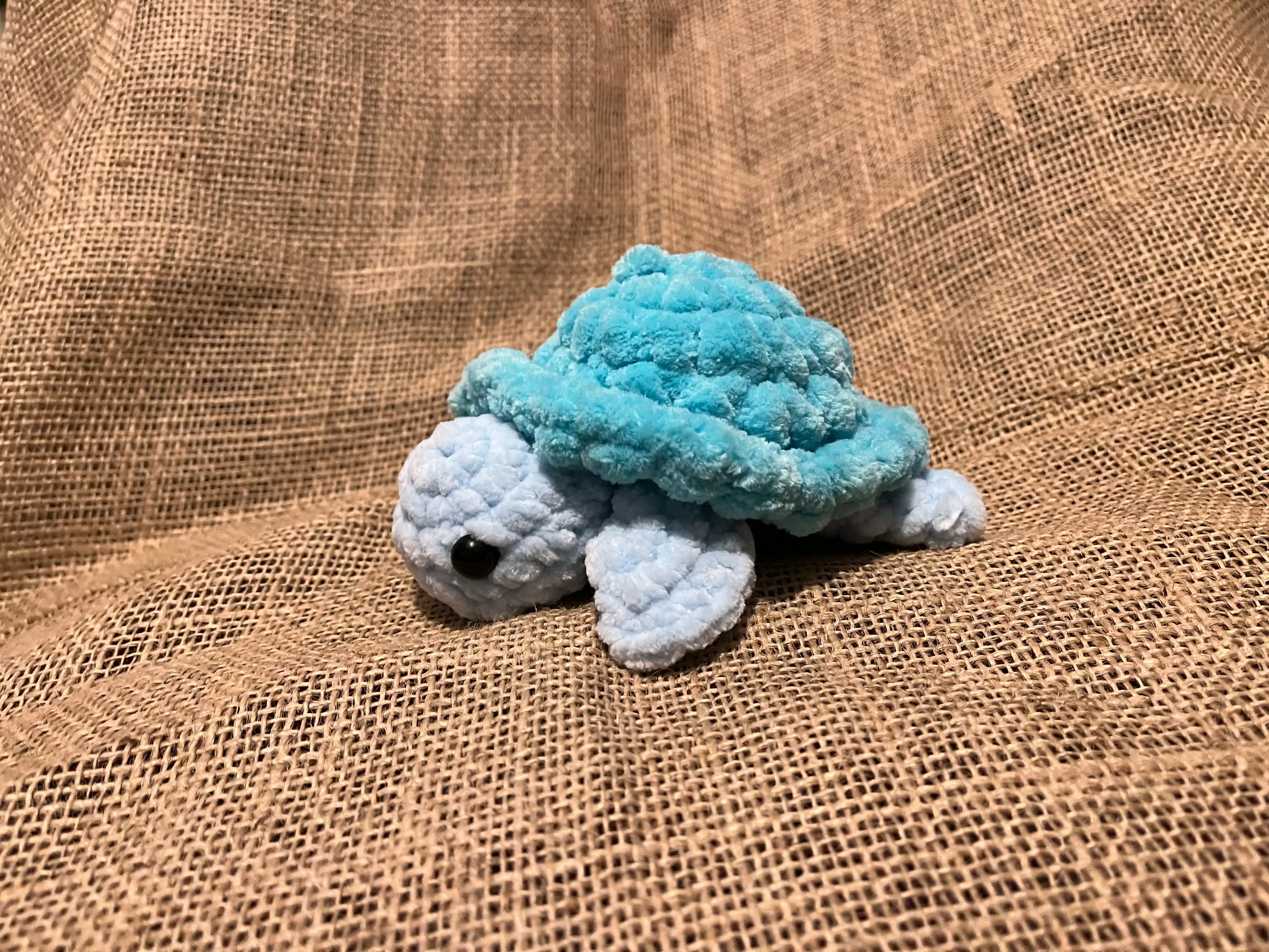 Knitted turtle soft toy